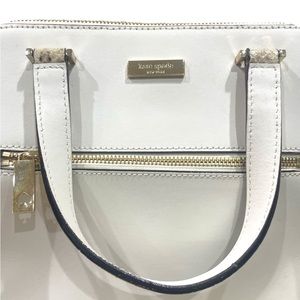 Satchel in croco emobossed leather. Front zip pocket,gold printed ksny signature